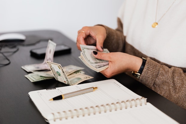 Person counting money